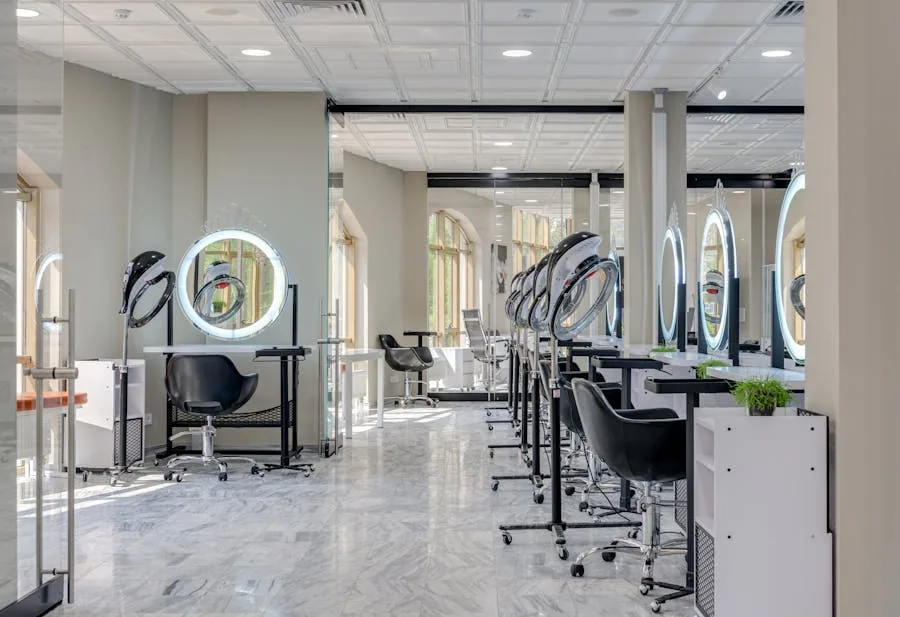 Bright modern hair salon interior with styling chairs and illuminated mirrors.